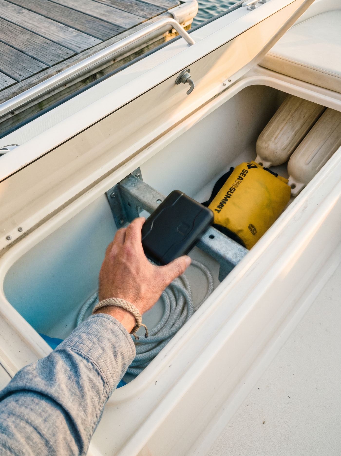 The Orb stowed in a boat's gunwale storage compartment